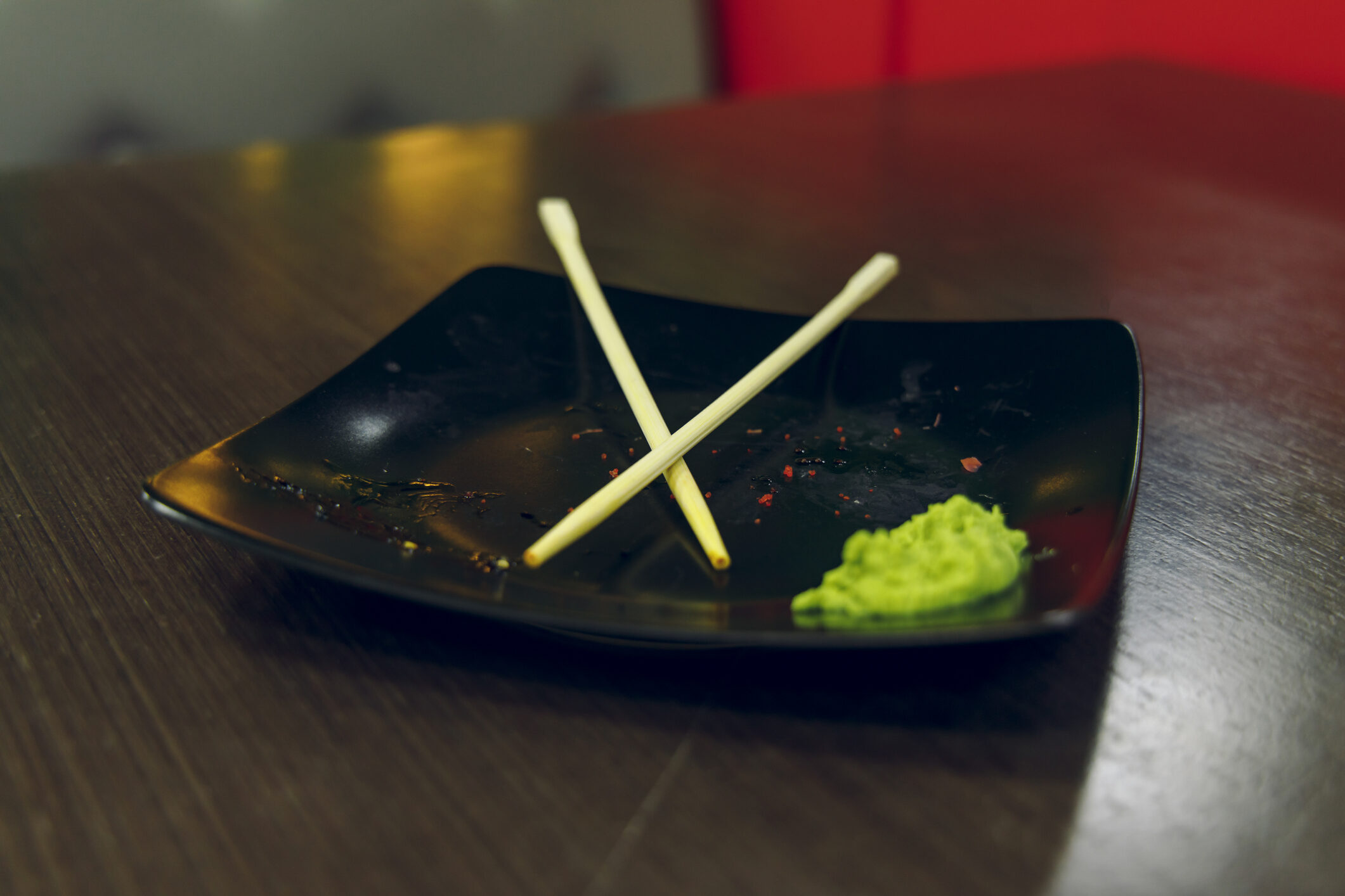 dusty-plate-after-sushi-rolls-asian-kitchen-restaurant-table-soft-focus-concept-picture-twilight-lighting