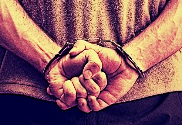 depositphotos_5136991-stock-photo-criminal-in-handcuffs-1660400